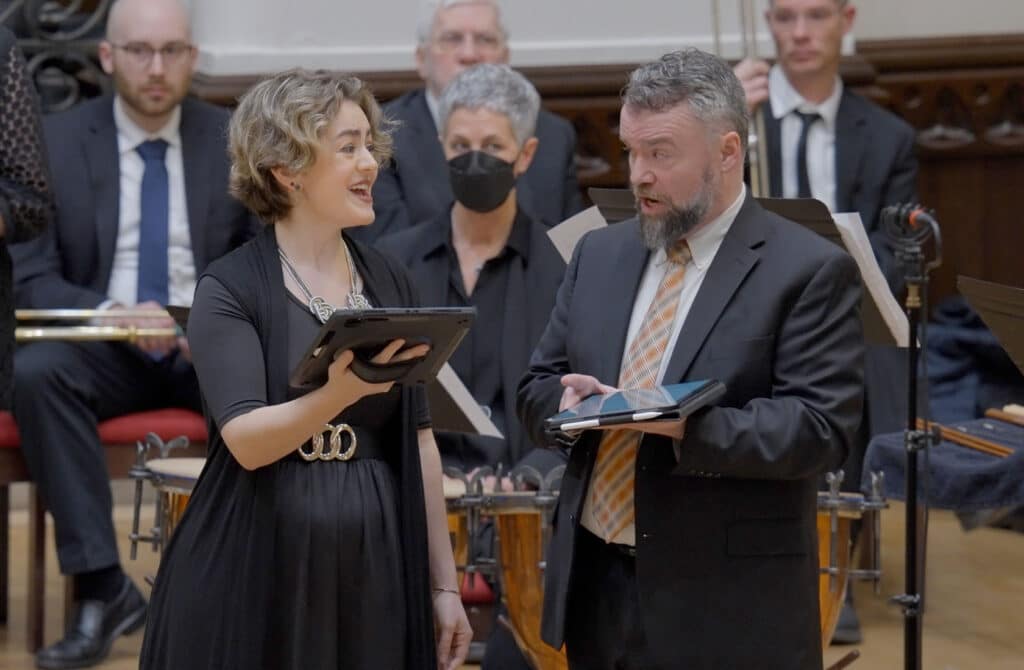 A man and woman singing a duet