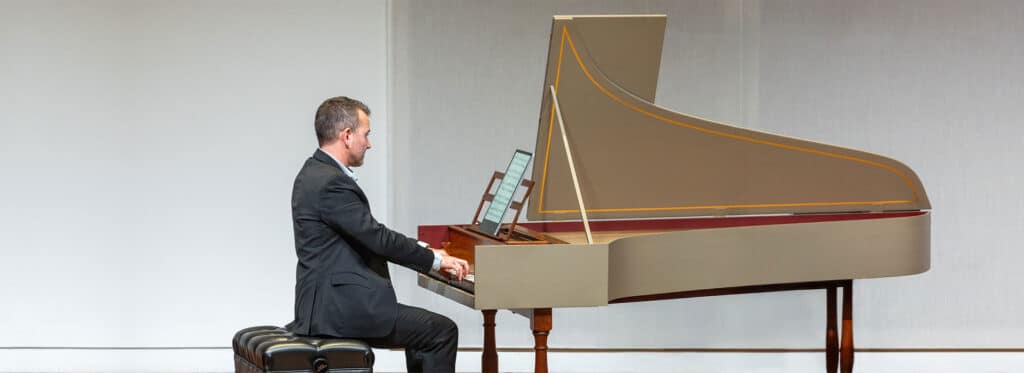 Adam Pearl playing the harpsichord
